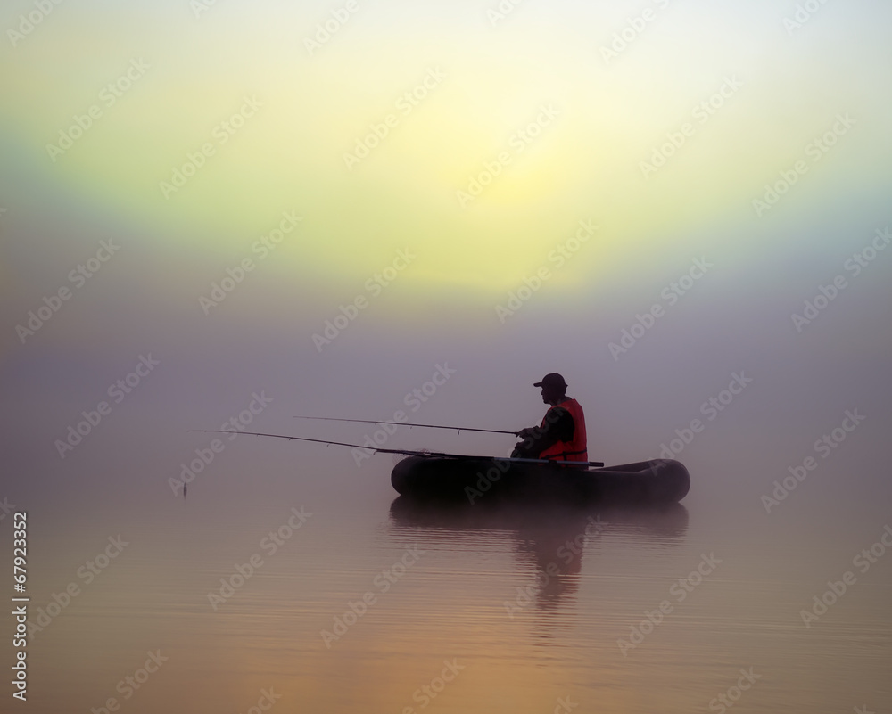The fishermen on the boat in the fog