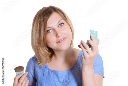 beautiful girl putting makeup