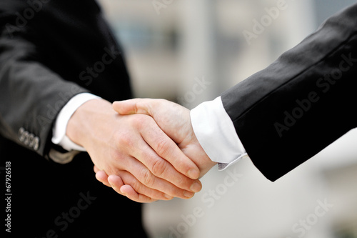 businessmen shaking hands - business deal partnership concept