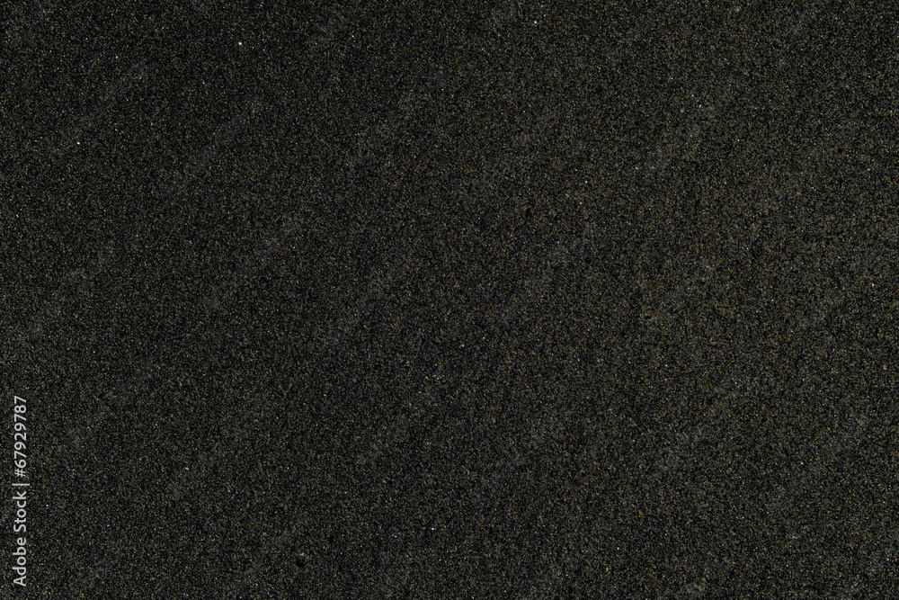 Fototapeta premium Black sand, closeup texture