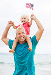 Father and son playing on the beach