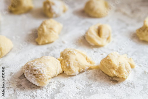 Preparing Dough for baklava at wooden table 