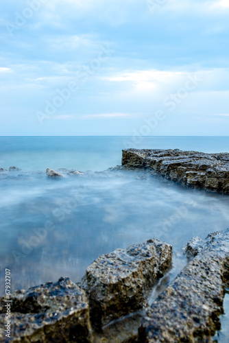 Nautical background with a rocky seashore