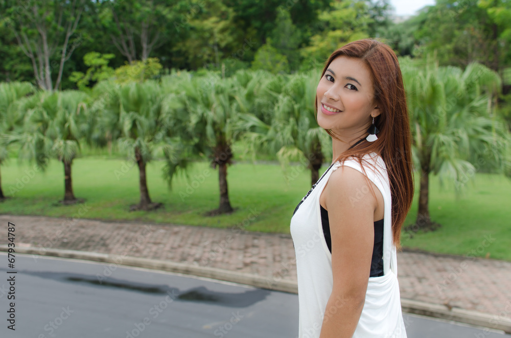 Beautiful young Asian woman in the countryside Beautiful young Asian woman in the countryside