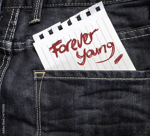 Forever Young written on a peace of paper photo