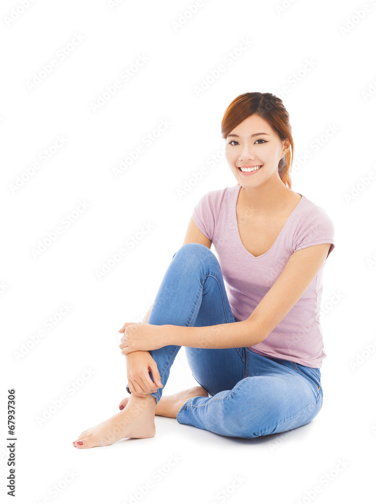 smiling beautiful young woman sitting on the floor smiling beautiful young woman sitting on the floor