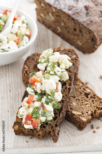 rye bread with cheese and vegetables, top view
