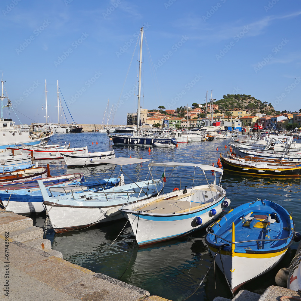 Boats in the small harbor of Giglio Island