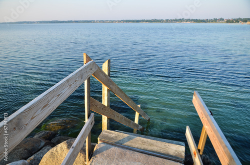 Wooden staircase to the water