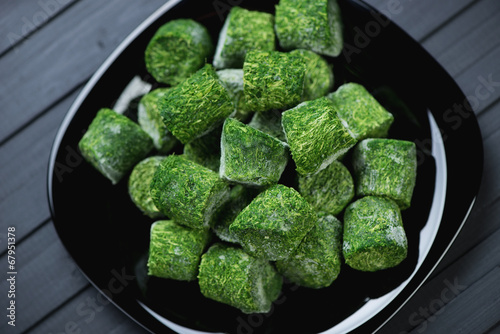 Cubes of chopped and compressed spinach, view from above