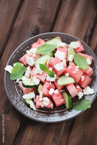 Plate with watermelon, cucumber and feta salad, high angle view