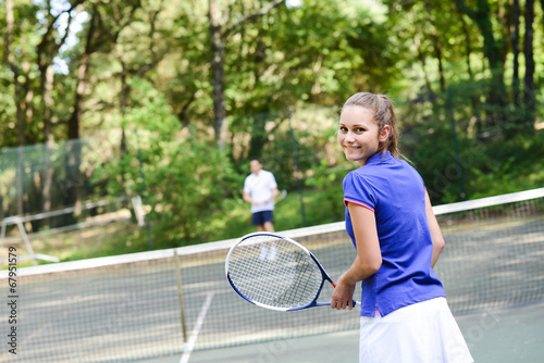 cheerful young woman playing tennis outdoor in summer © W PRODUCTION