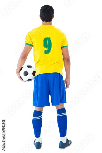 Football player in yellow holding ball © WavebreakmediaMicro