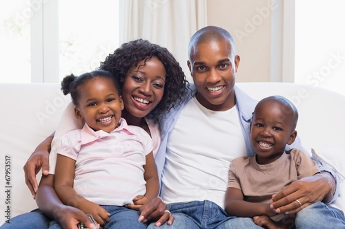 Happy family smiling at camera together © WavebreakmediaMicro