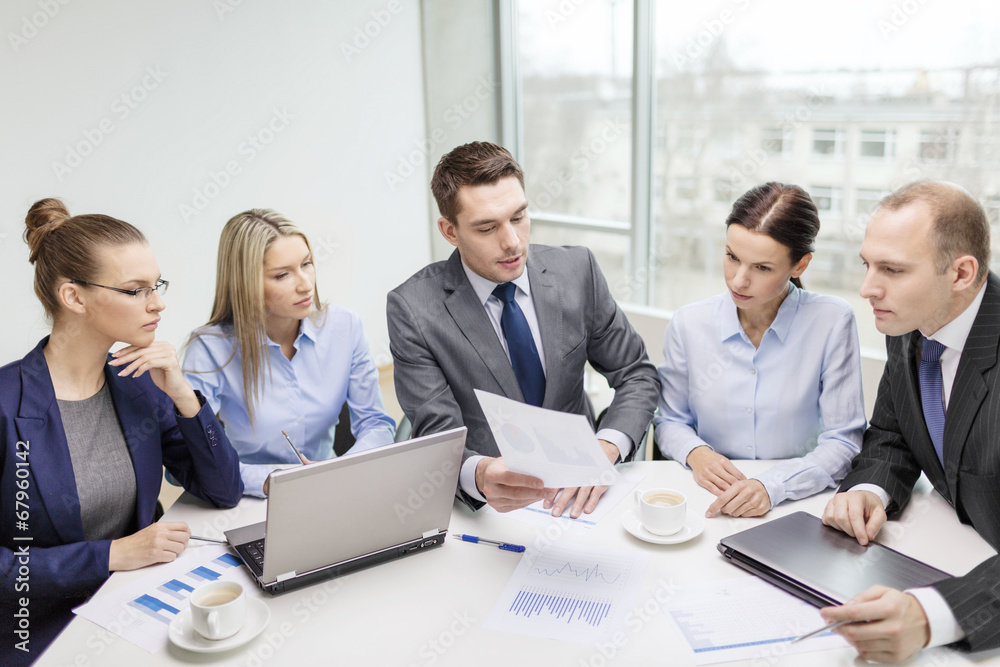 business team with laptop having discussion business team with laptop having discussion