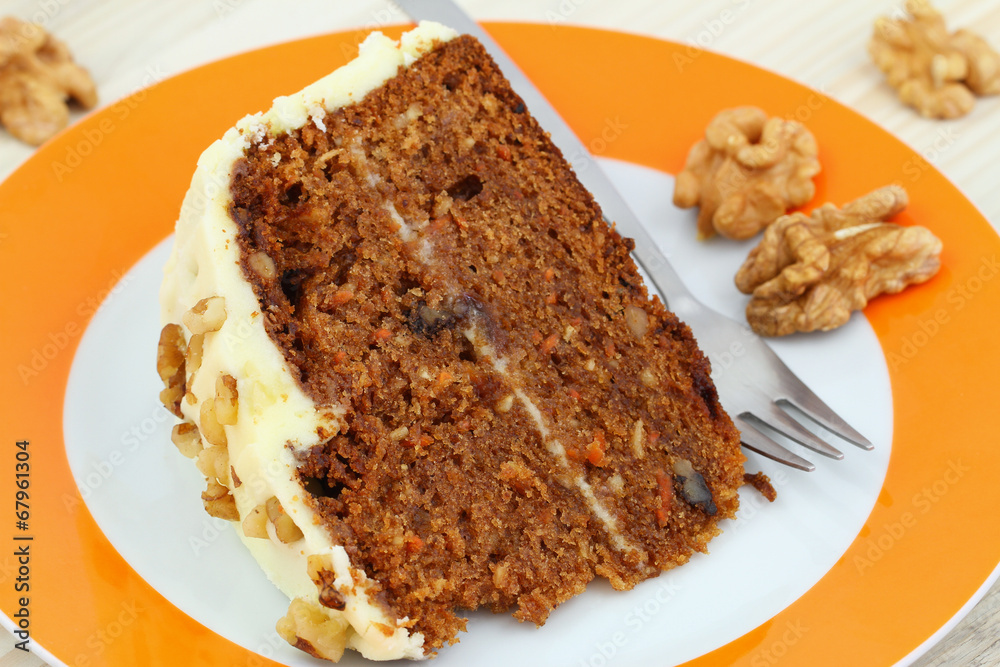 Carrot cake with walnuts and marzipan icing, close up Carrot cake with walnuts and marzipan icing, close up
