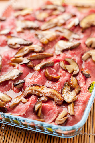 Carpaccio di carne rossa con funghi porcini photo