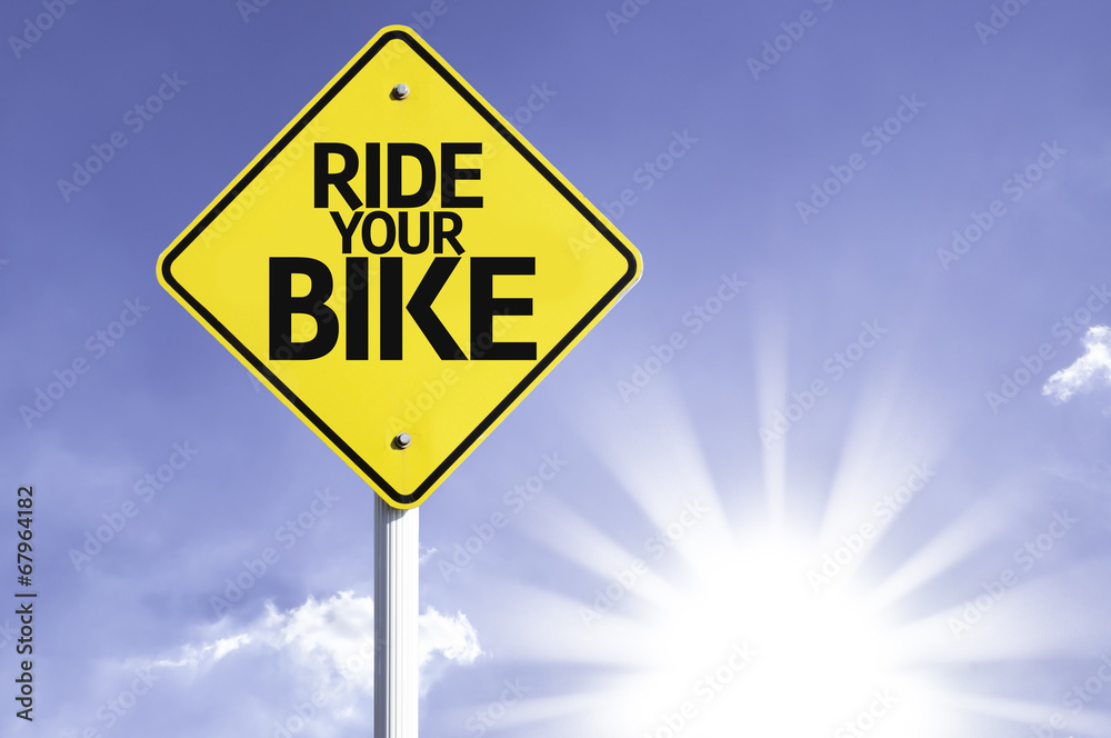 Ride your Bike road sign with sun background Ride your Bike road sign with sun background