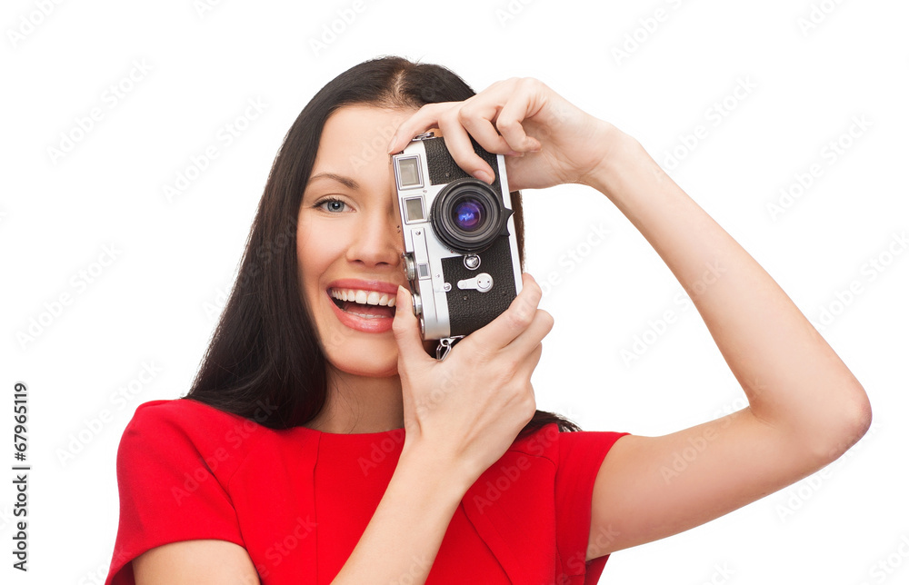 smiling woman taking picture with digital camera smiling woman taking picture with digital camera