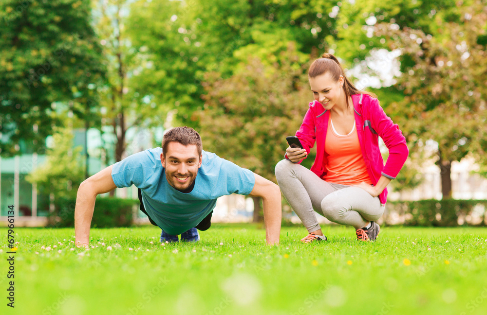 smiling man doing exercise outdoors