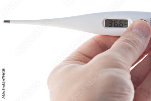 Hand holding electronic thermometer