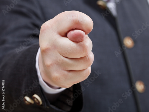 businessman holds fig sign close up photo