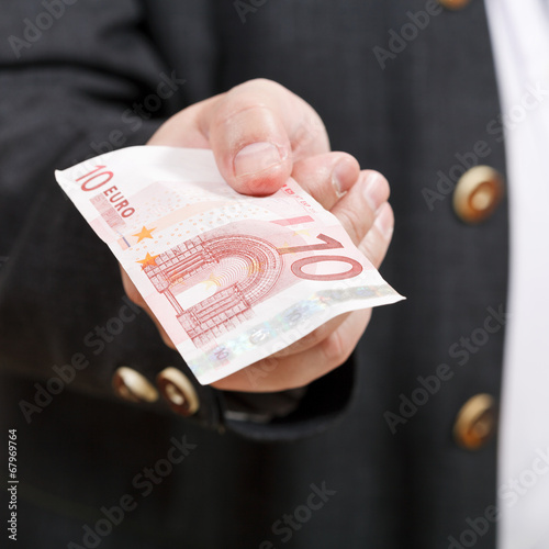 front view of 10 euro banknote in businessman hand photo