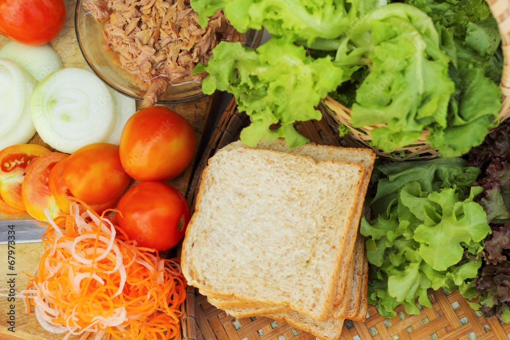making tuna sandwich with fresh vegetables making tuna sandwich with fresh vegetables
