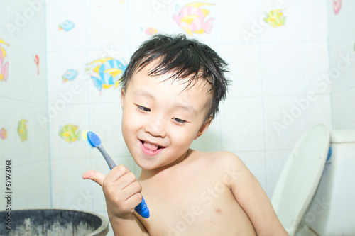 Asian boy in a shower