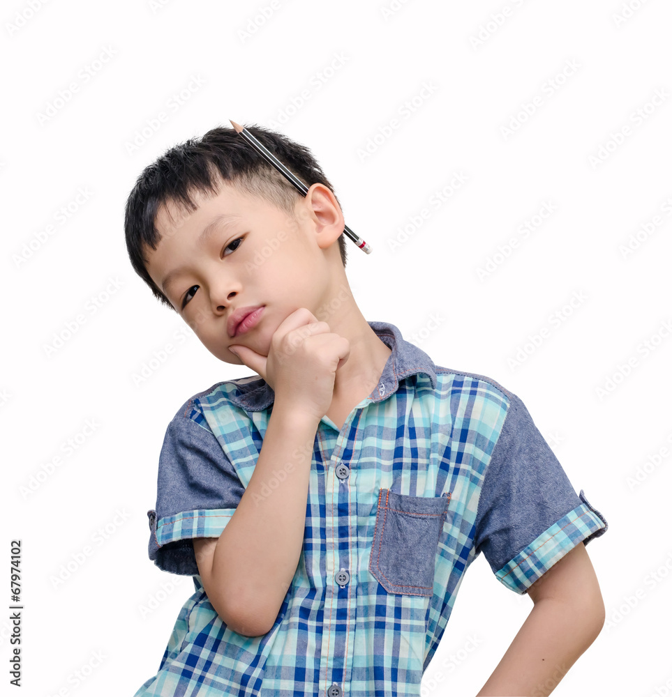 Young Asian boy looks serious with pencil on his ear over white Young Asian boy looks serious with pencil on his ear over white