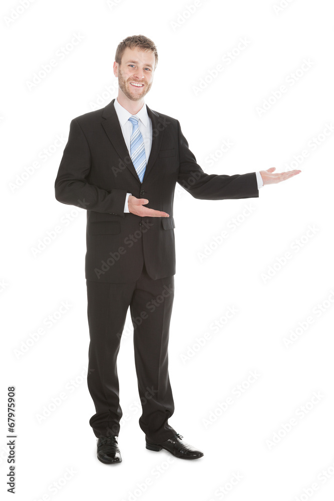 Confident Businessman Welcoming Over White Background Confident Businessman Welcoming Over White Background