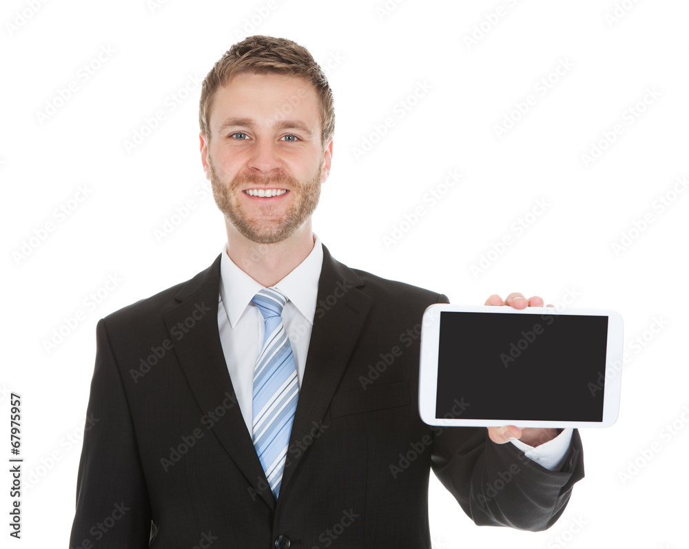 Smiling Businessman Displaying Digital Tablet Smiling Businessman Displaying Digital Tablet