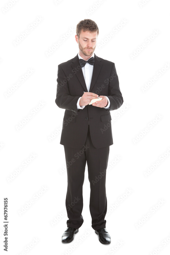 Mid Adult Waiter Writing On Notepad Mid Adult Waiter Writing On Notepad