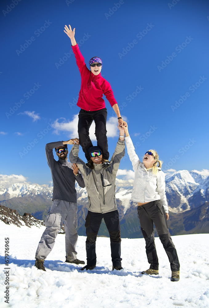 Team on the snow mountain top. Sport and active life concept