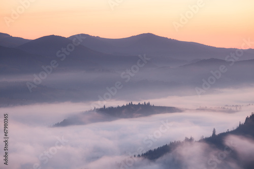 Mountains ridge at foggy morning