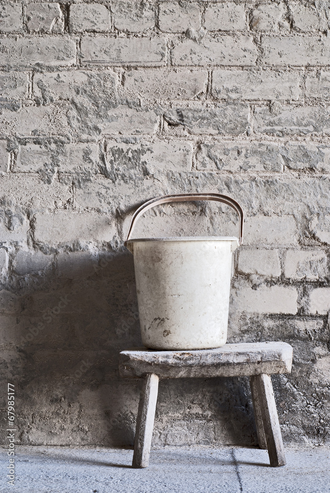 grunge wall, white plastic bucket grunge wall, white plastic bucket