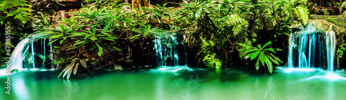 Panorama of waterfall in garden design. photo