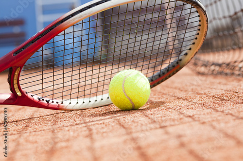 tennis racket and ball on the tennis court  © lusia83