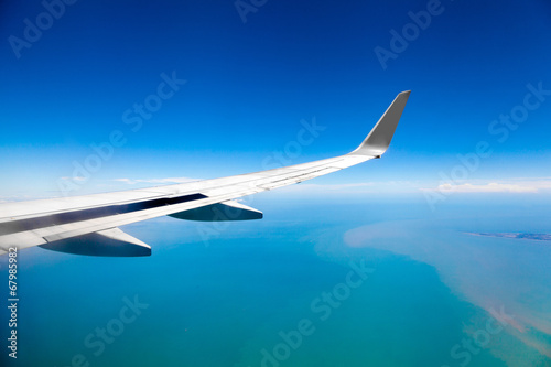 Classic image through aircraft window onto jet engine