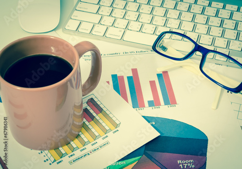 business charts or graphs with keyboard old style (vintage)