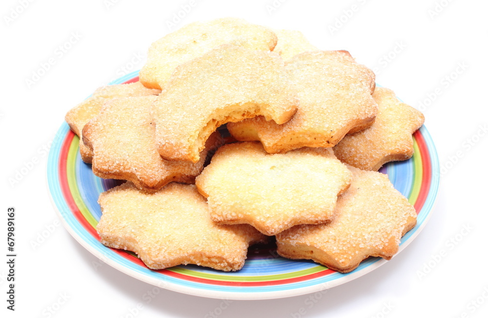 Fresh homemade cookies on colorful plate. White background Fresh homemade cookies on colorful plate. White background