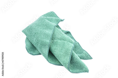 Crumpled green microfiber cloth isolated on white background photo