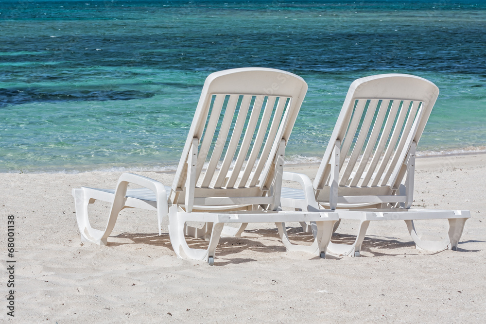 Sun loungers facing the Caribbean Sea