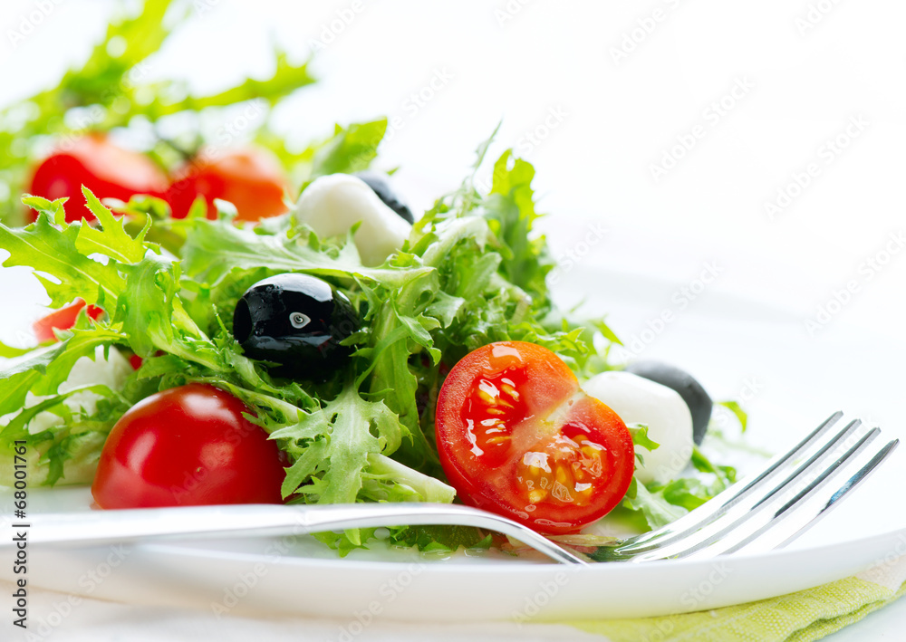 Salad with Mozzarella Cheese isolated on white background Salad with Mozzarella Cheese isolated on white background