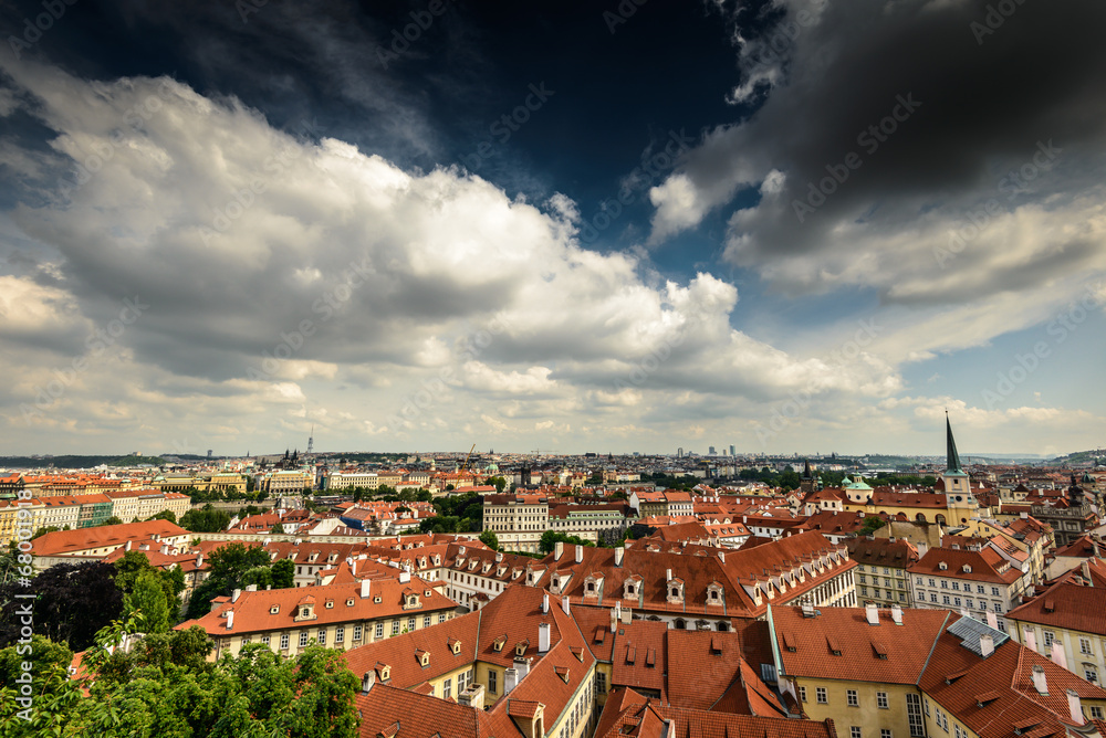Photo of red tile rooftops and cloudy sky,Prague