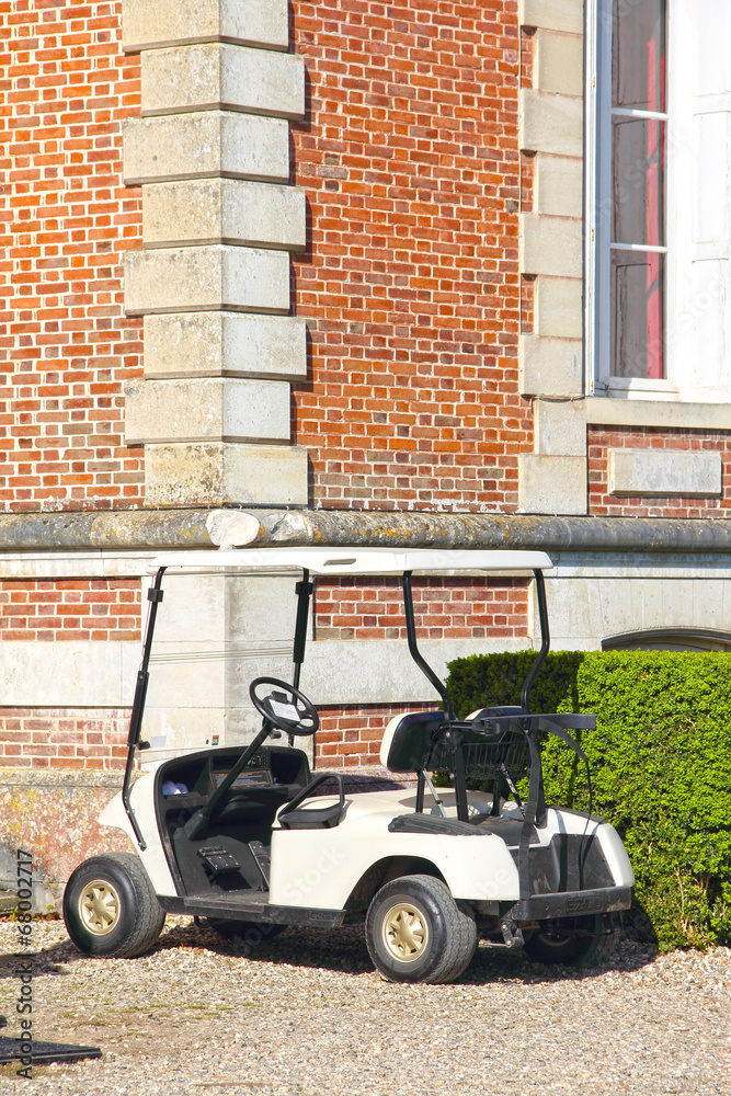 Golf cart near club