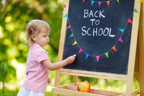 Excited little girl going to a preschool