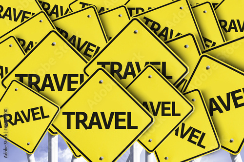 Travel written on multiple road sign