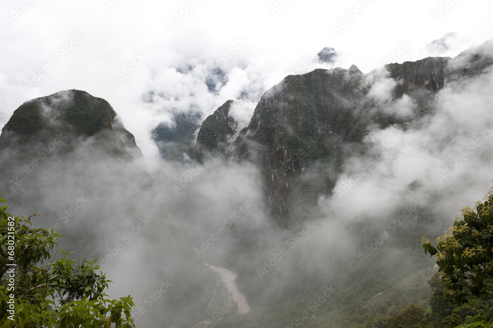 A view from Machu Picchu on a cloudy day.