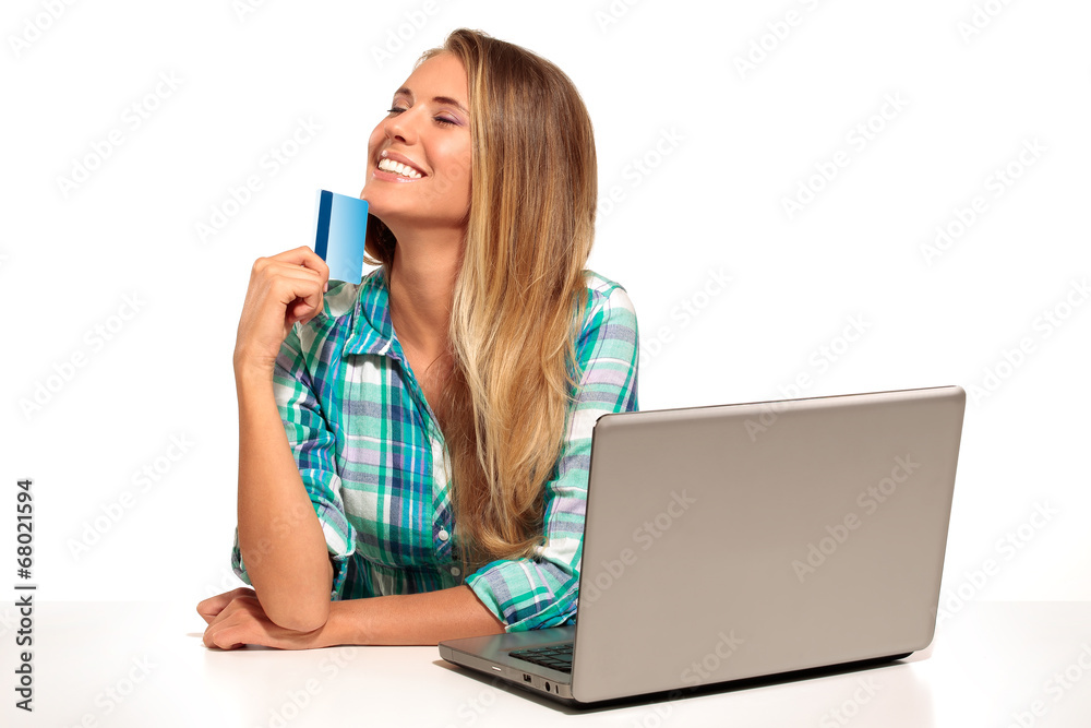 Young Woman Sitting at the desk shopping Online Young Woman Sitting at the desk shopping Online
